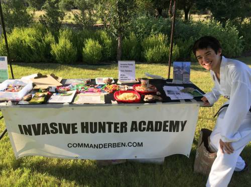 Setting up the Invasive Hunter Academy with samples of edible invasive plant species